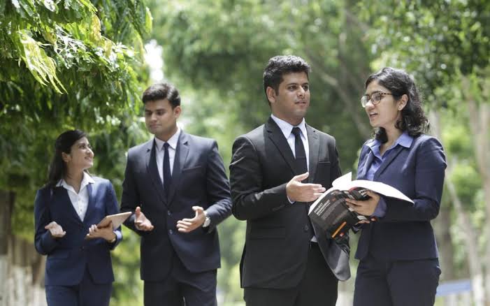 Young founders in conversation while walking