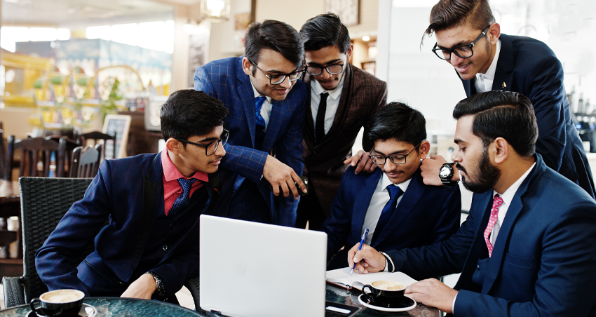 Young founders working through a plan together on a laptop